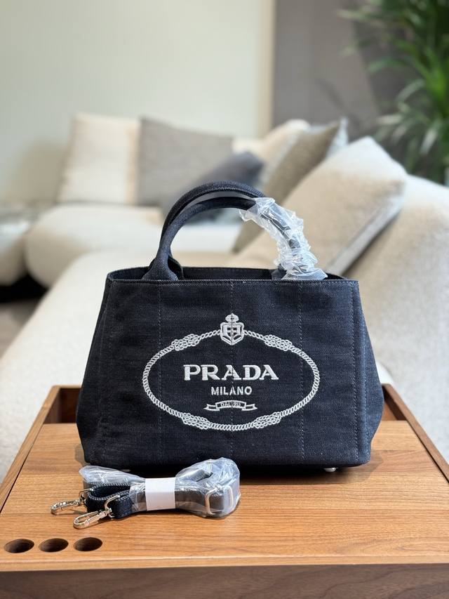 This Prada dark blue denim beach bag Canapa is made of a material that is unexpe