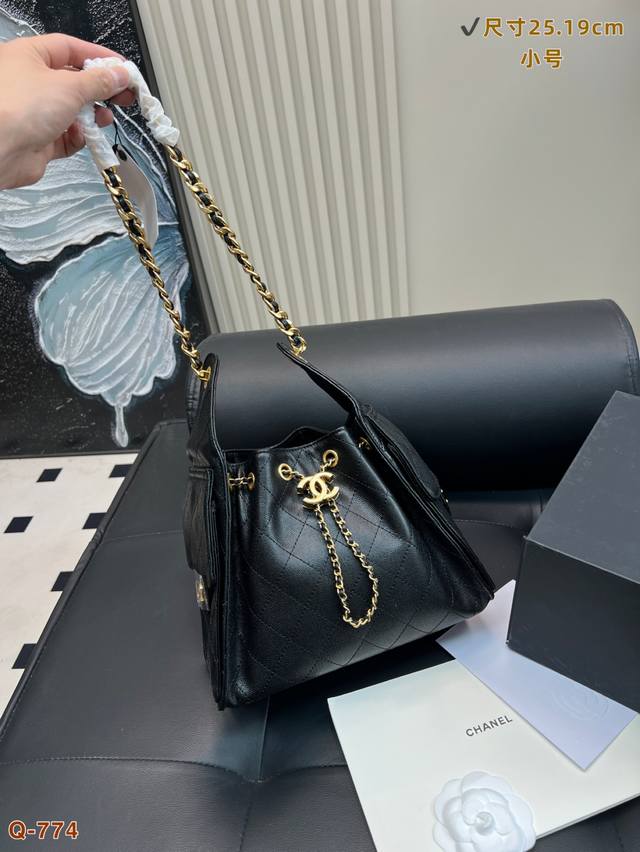 with folding box Chanel black and gold hippie bucket bag is large and can hold m