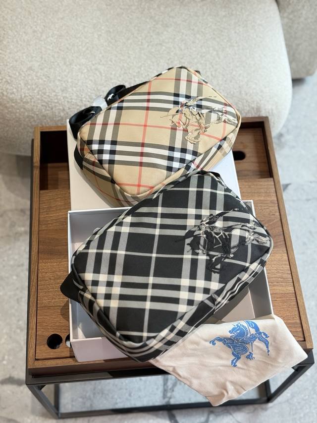 Burberry's handsome camera bag has arrived in the store . It is the first choice