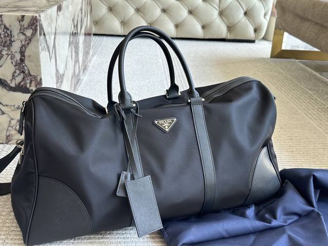 No box Size: 55*25Cm The versatile and durable Prad black travel bag Looks great