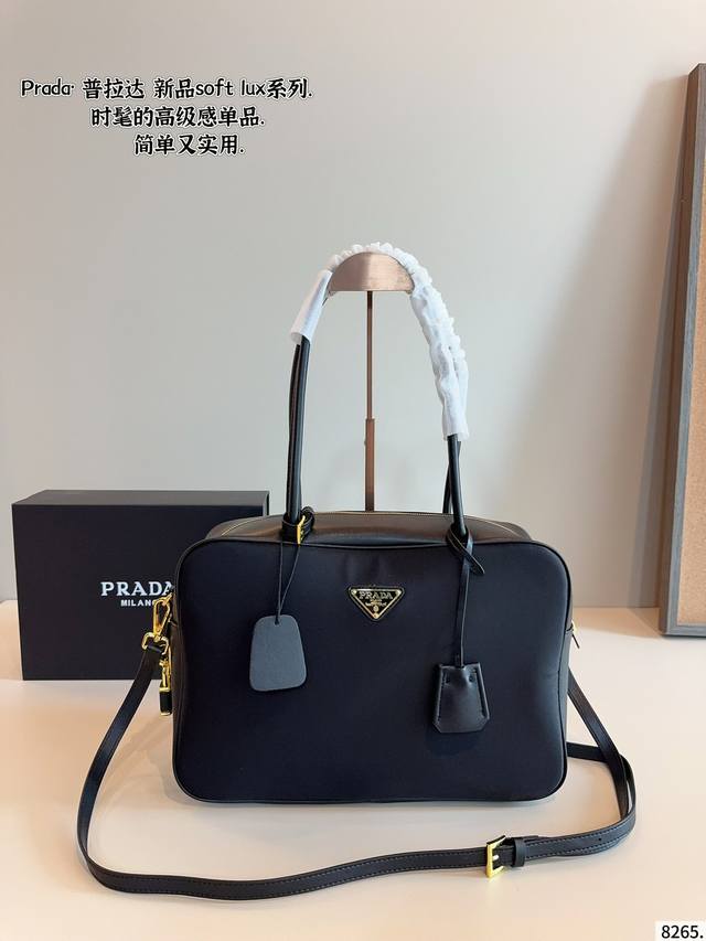 Prada's new Soft Lux shoulder bag. Can be carried by hand or worn cross-body Fas