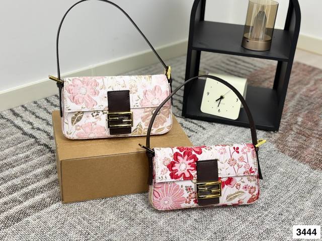 with box The Fendi Baguette bag immediately caught my eye. The medium size has a