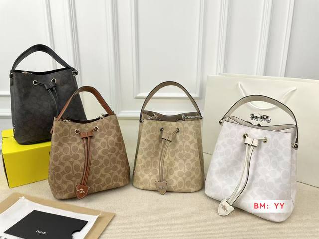 with box Coach's new Rowan Bucket bag The new bucket bag has a drawstring design