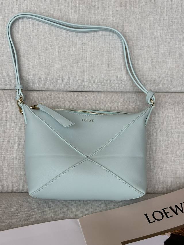 Original leather LwNew Glacier Blue Puzzle Fold Pouch handbag reinterprets the p