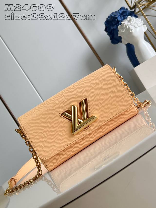 Top original home photo M24603 Apricot This Twist West handbag has a slender sh