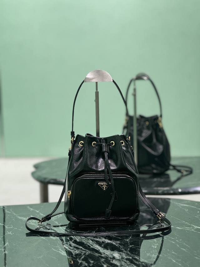 Bucket Wrinkled Patent Leather This bucket bag is made of imported lacquered co