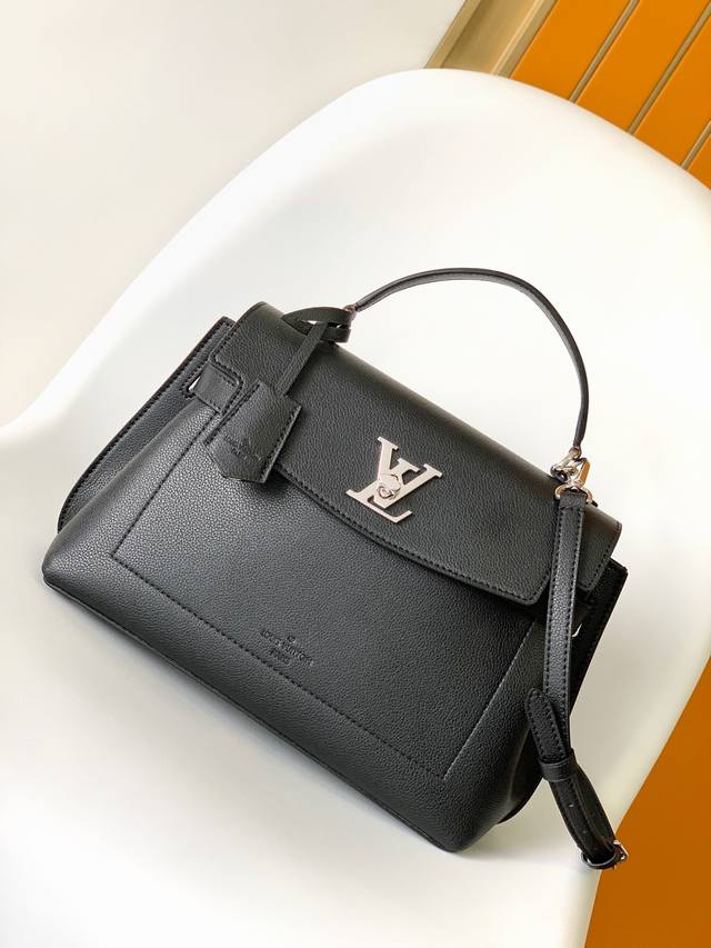 M51395BlackM56094GrayTop Original This Lockme Ever single handle bag is made of