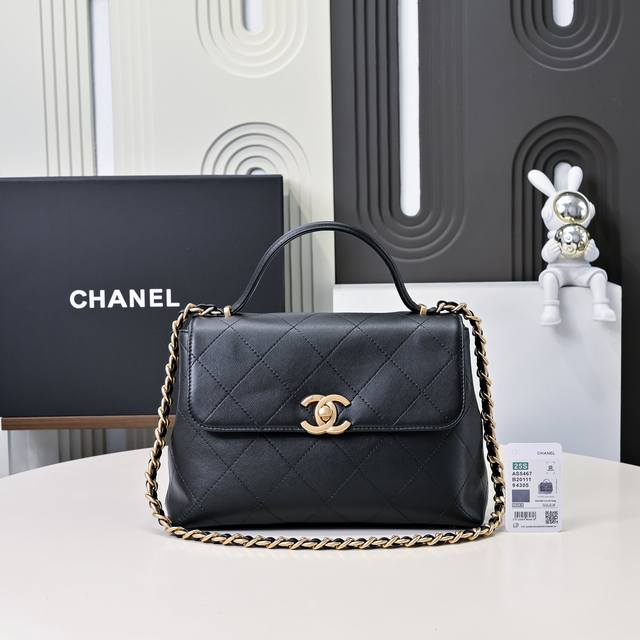 The small 25S black and gold briefcase flap bag is so cool! The hand carries a