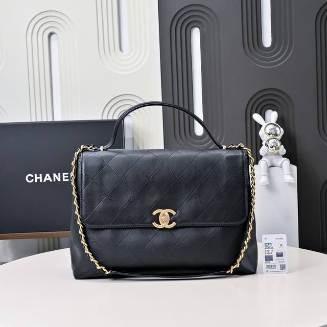 The large 25S black and gold briefcase flap bag is so cool! The hand carries a