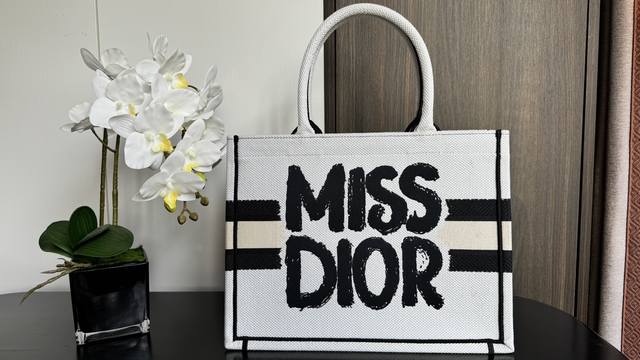 New Stamp Series This Book Tote handbag is designed by Maria Grazia Chiuri, Cre