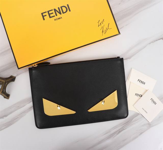 Brand: Fendi Model: Gold Iron Clutch Item No.: 168568 Color: Black + Gold Iron S