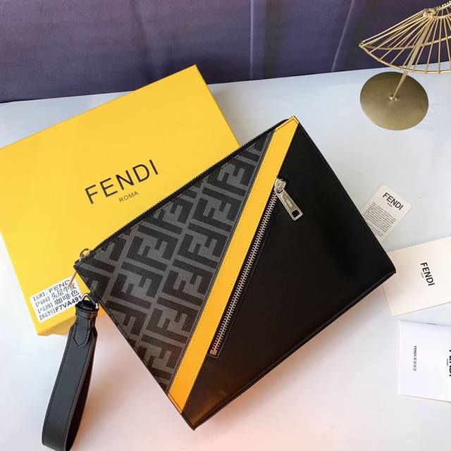 Style No. F7Va491 Fabric: black with yellow, clutch with detachable chain handl