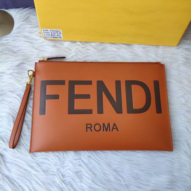 F8N0178Large brown clutch with removable chain handle, zipper closure, printed F