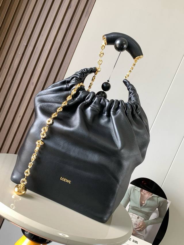 The same medium Nappa sheepskin Squeeze handbag as the celebrity's. It is a deli