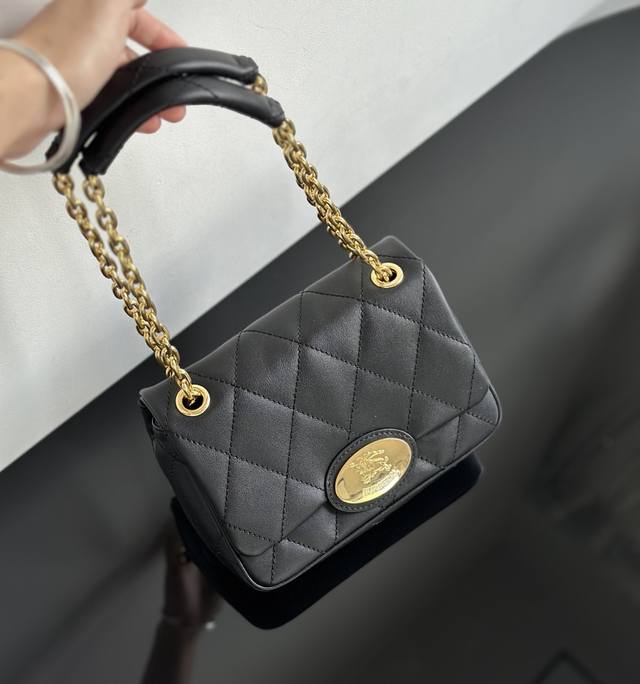 Black real shot of the small Strand bag, Classic plaid elements, such as the cl