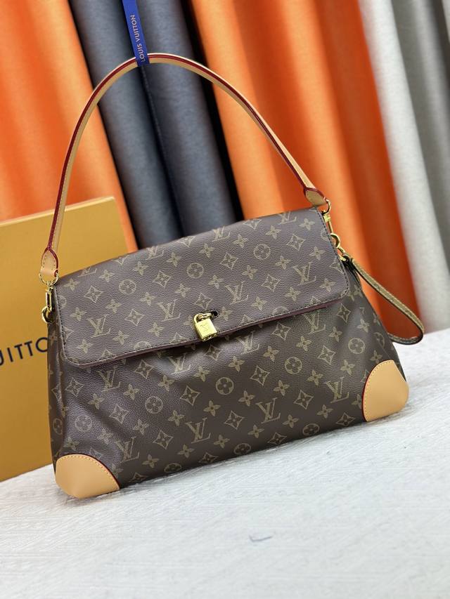 M14473 The Hide Away bag is made of Monogram coated canvas, combining clean line