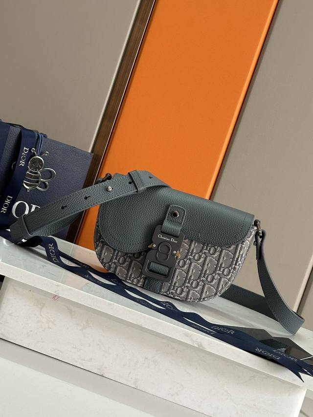 AuthenticThis Saddle Clutch with Shoulder Strap is a new piece from the Spring 2