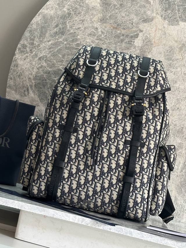 Authentic, high version This Dior Hit The Road flap backpack combines modern sty