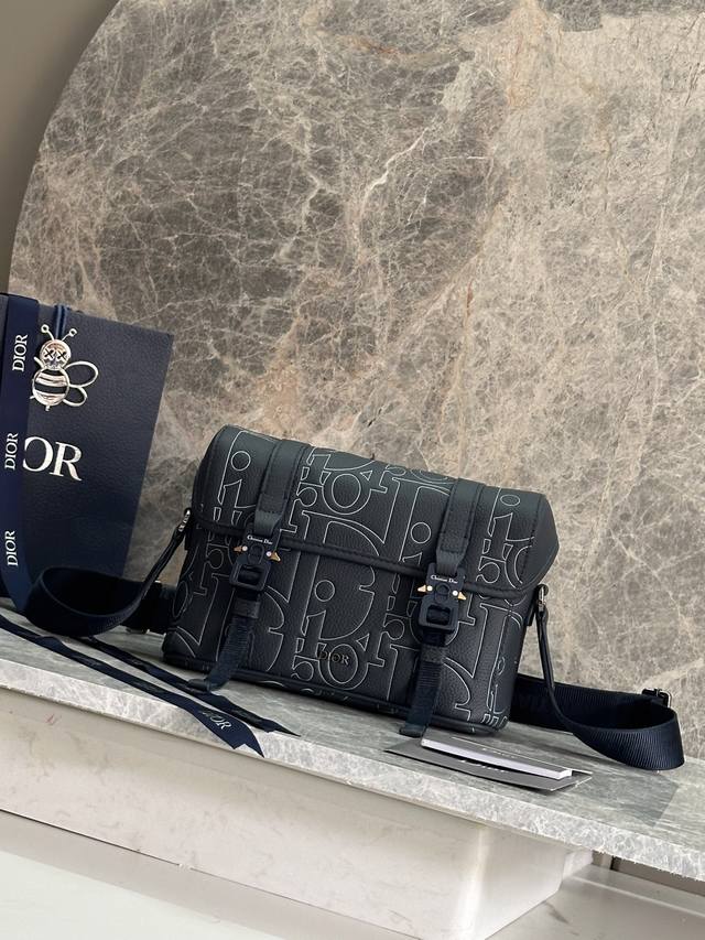 Authentic, High Edition This flap messenger bag further enriches the Dior Hit Th