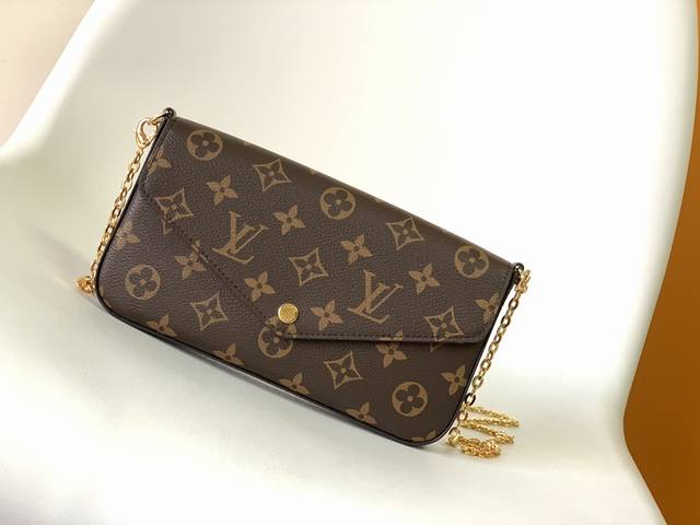 M61276The Pochette Felicie is an elegant and compact bag with two removable pock