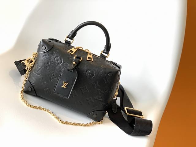M45393BlackM45394WhiteThe original Petite Malle Souple is made from embossed Mon