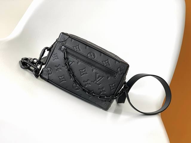 M55702 The original Soft Trunk mini bag is made of Taurillon leather with a Mono