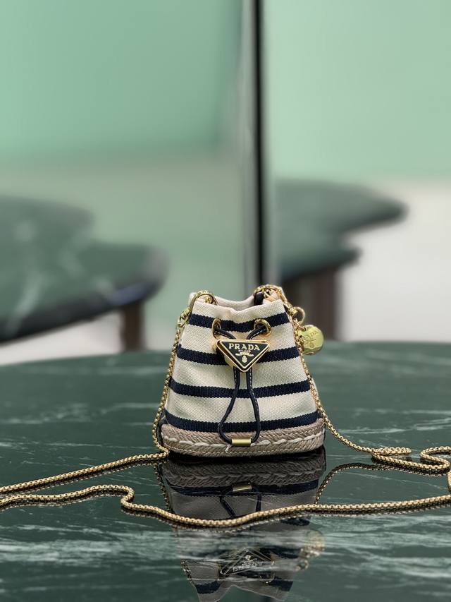 Mini BucketThis mini bag reinterprets the classic nautical style, presenting an