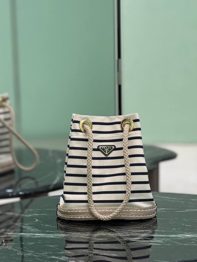 New Bucket Bag This fabric bucket bag is decorated with nautical stripes to add