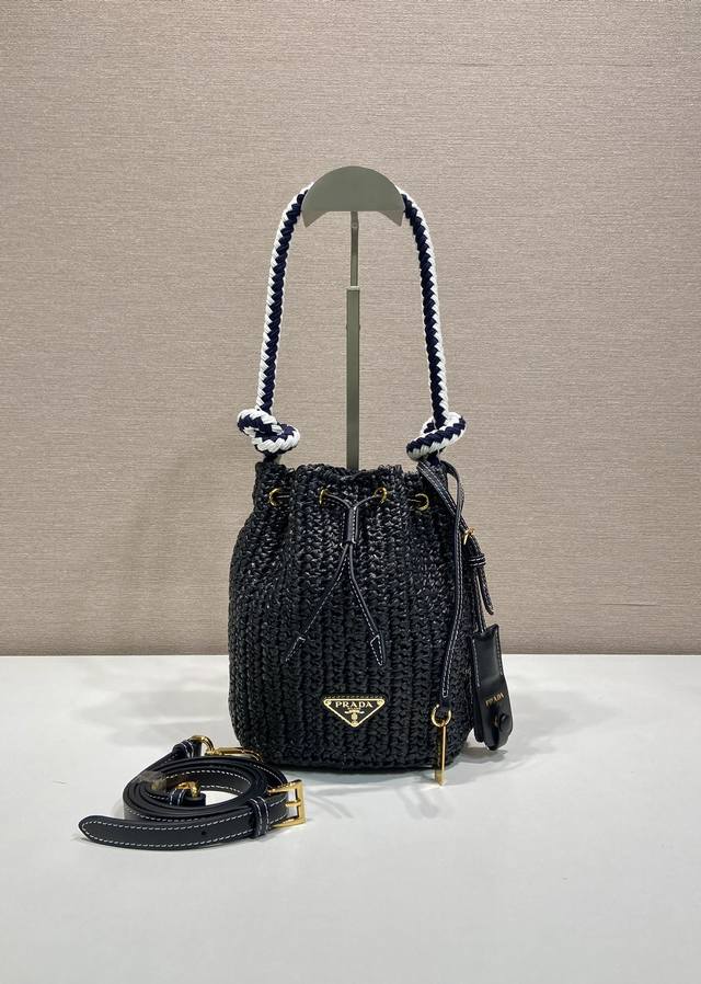 New woven 1Be068 bucket bag This woven bucket bag is made of imported raffia. P
