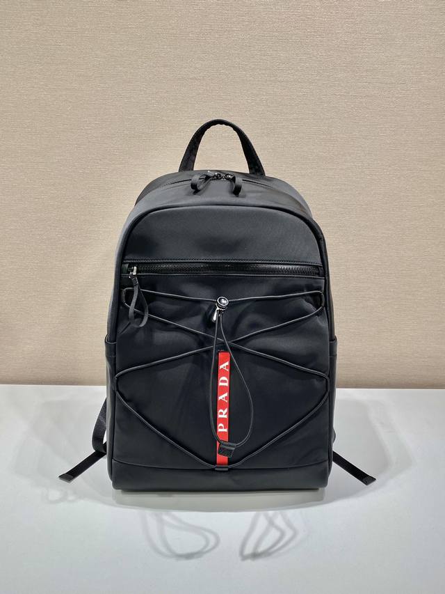 New Backpack 2Vz085 This backpack is made of imported nylon and features a spac