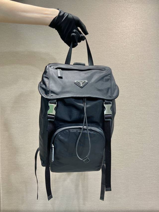 Women's Backpack 1Bz039 Backpack This nylon backpack is decorated with Saffiano