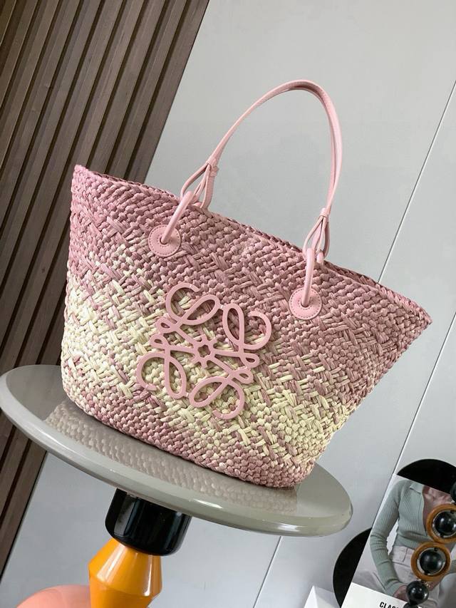 Large Iraca Palm Fiber and Cow Leather Anagram Basket Handbags. Many celebritie