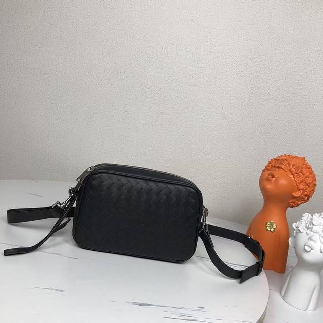 Bvlntrecciato woven leather crossbody bag with zipper closure, the space is just