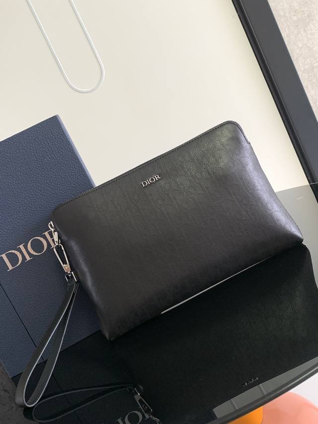 with box + beePractical and elegant, this clutch has a spacious interior to stor