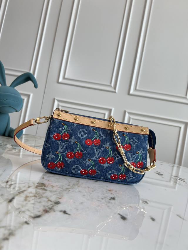 Chip version M13994 Cherry Pochette Accessoires handbag is made of coated canva