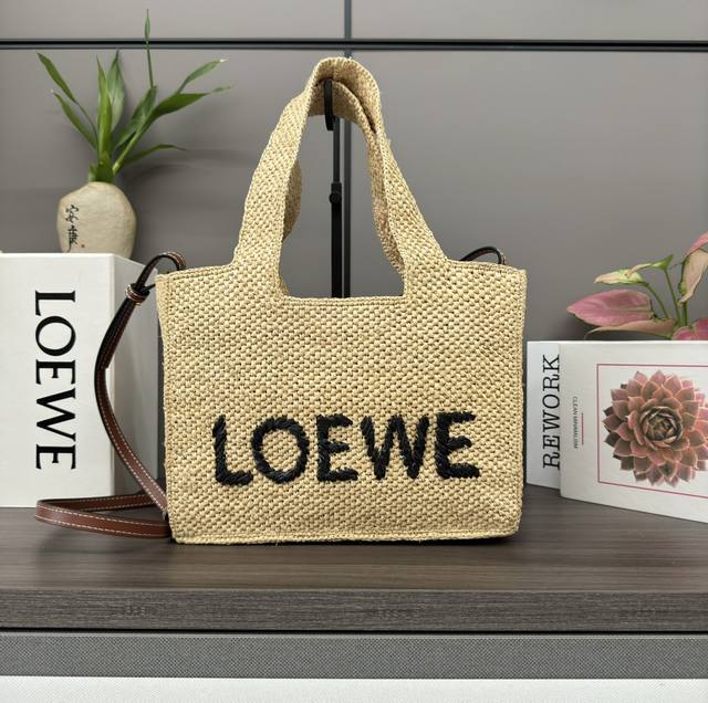 LowThe new Small Raffia Font Tote is a rectangular bag with a contrasting Loe*We