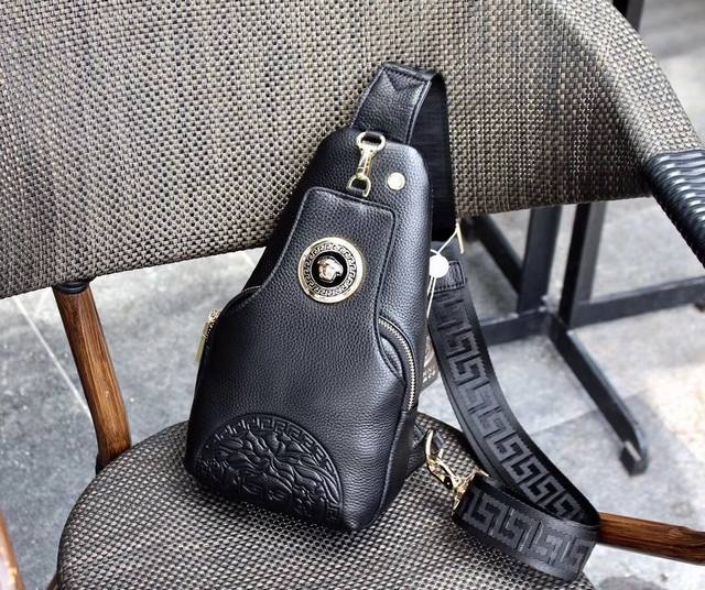 Versace This soft cowhide chest bag is decorated with a large embossed Medusa ci