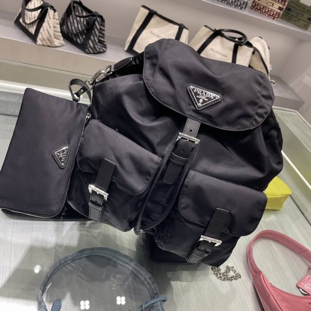 New Backpack 1Bz811 This nylon backpack is trimmed with exquisite Saffiano leath