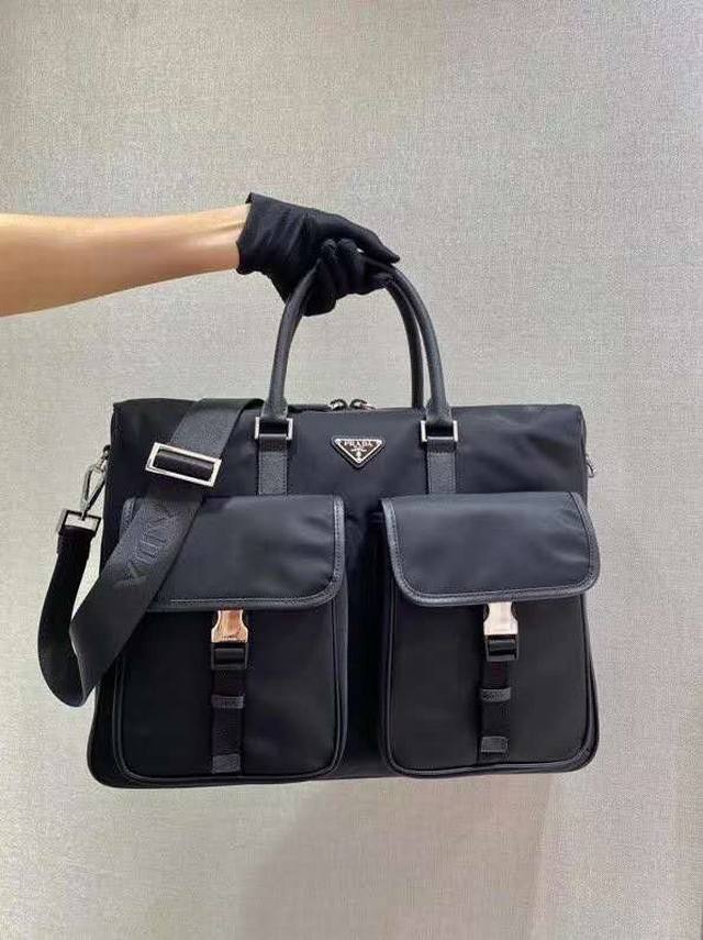 New Nylon Briefcase 2Ve017 This nylon briefcase is decorated with Saffiano leat