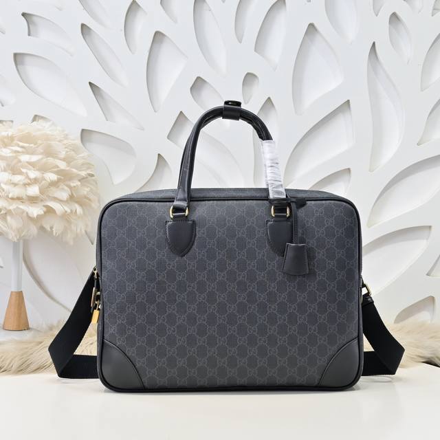 Gucci-Gucci's latest briefcase handbag is made of imported calfskin leather. It