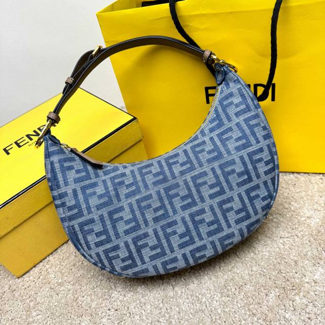 Fendigraphy Small Crescent Bag. Its modern shape is decorated with eye-catching