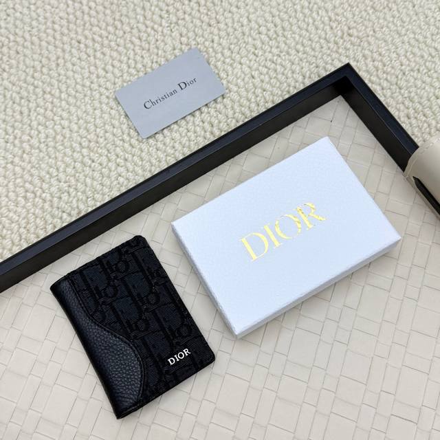 Dior's new bifold cardholder is an elegant accessory that showcases Dior's exqui