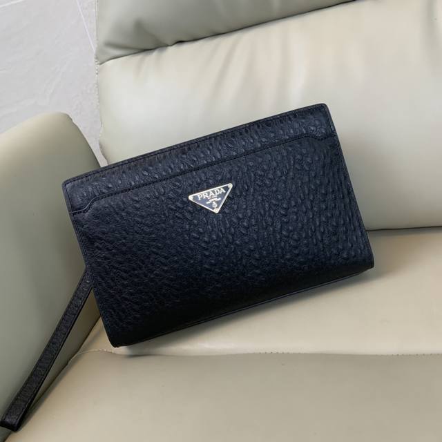The latest and hottest Prada ostrich leather combination lock clutch bag from t