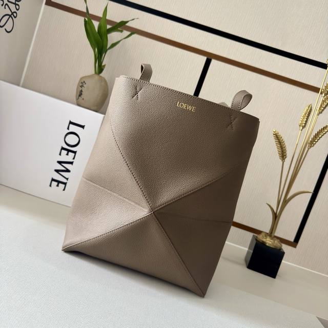 Lw The new small soft grain cow leather Puzzle Fold Tote features a lightweight