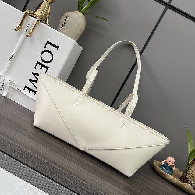 Low Shiny cow leather Puzzle Fold Cropped handbag is reinterpreted with panels r