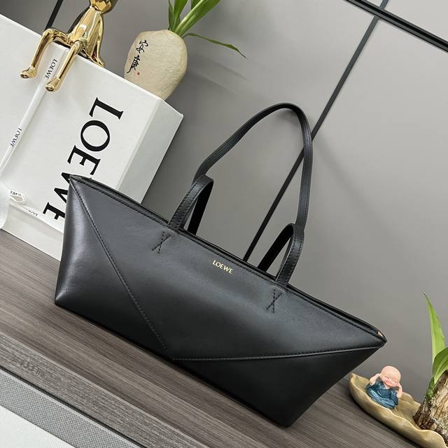 Low Shiny cow leather Puzzle Fold Cropped handbag is reinterpreted with panels r