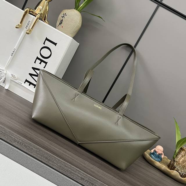 Low Shiny cow leather Puzzle Fold Cropped handbag is reinterpreted with panels r