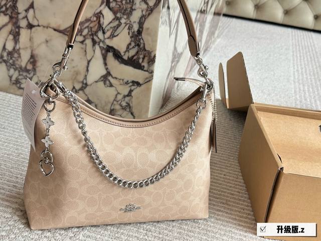Upgraded versionSize: 31*23Cm with pendantCoach's new Laurel hobo bag is really