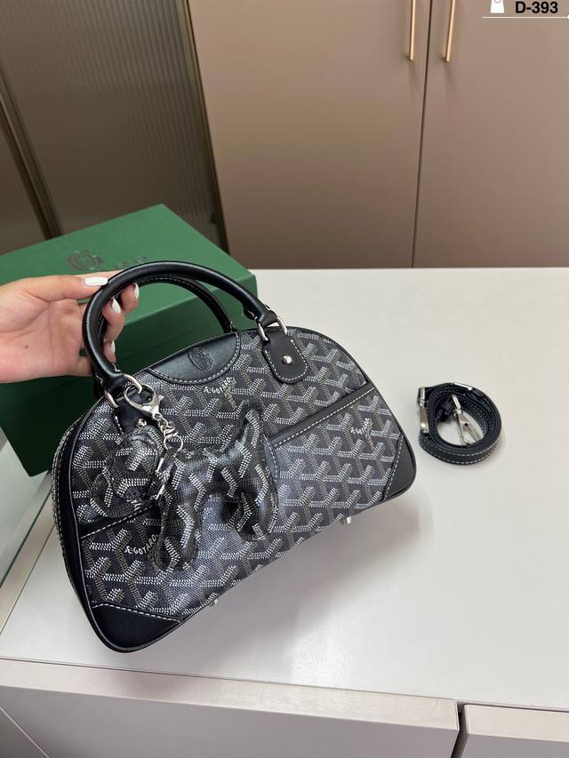 Goyard Goya's iconic bowling bag! It can hold cell phones, lipsticks, card holde