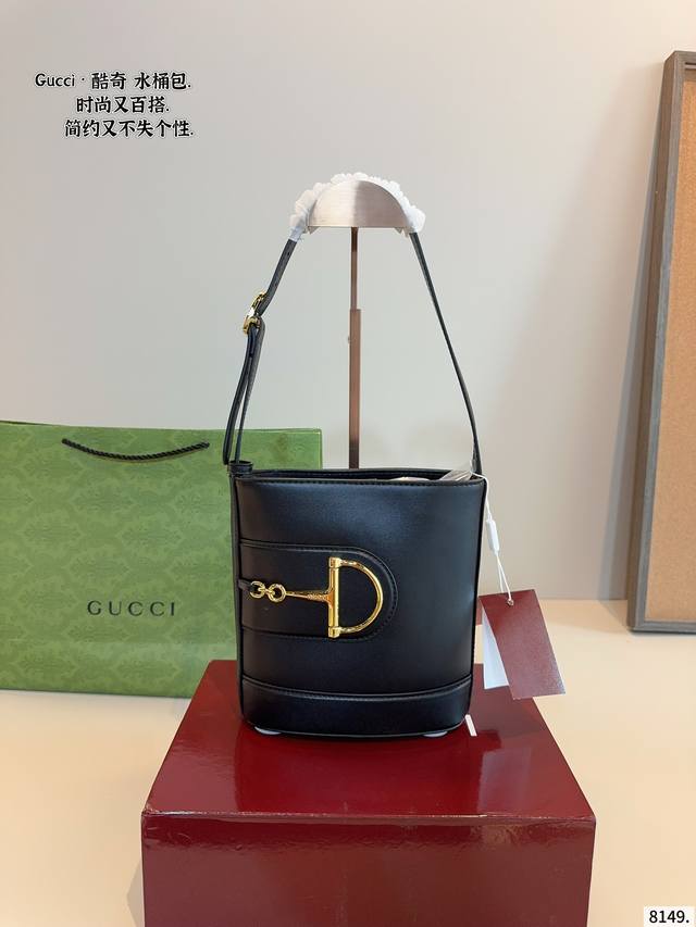 with gift box Gg mini bucket bag G logo Gg mini bucket bag. Gucci traces the br